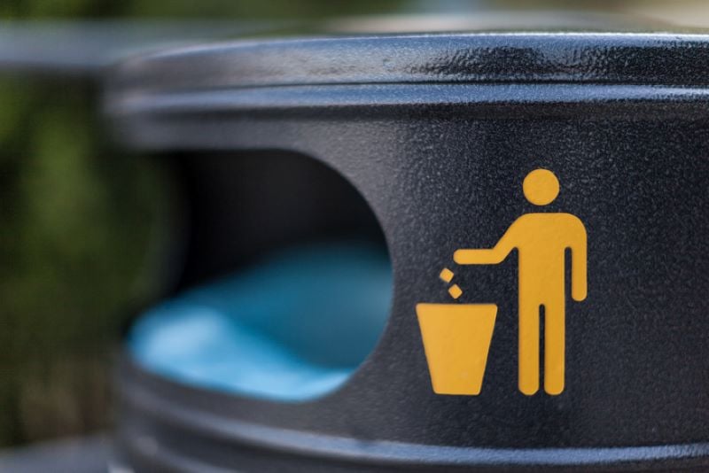 closeup of trash icon on garbage can - what is waste